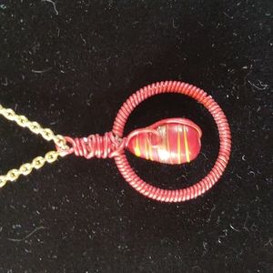 Hand wired with red wire and orangish red beads